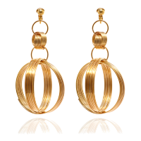 a pair of gold globe earrings